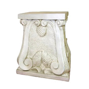 Ornate pedestal with classical scrollwork, textured surface, and old world European Baroque-inspired decorative details.