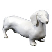 Dachshund figurine with smooth, classical lines and subtle old world European sculptural details