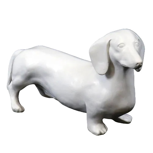 Dachshund figurine with smooth, classical lines and subtle old world European sculptural details