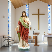 Sacred Heart of Jesus statue in classical Renaissance style, ornate robes, detailed facial features, standing on a cloud base. Side View