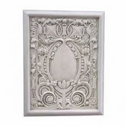 Ornate rectangular wall plaque with classical Baroque detailing, featuring intricate scrollwork and symmetrical floral motifs.