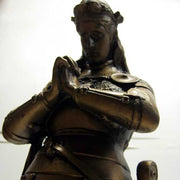 Kneeling medieval knight in ornate armor, hands clasped in prayer, classical old world European style with Gothic detailing. Other Angle