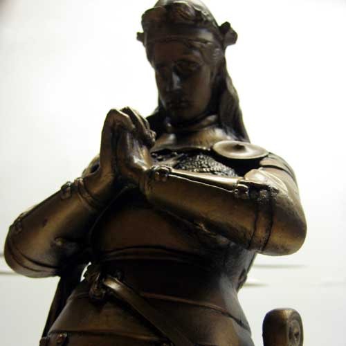 Kneeling medieval knight in ornate armor, hands clasped in prayer, classical old world European style with Gothic detailing. Other Angle