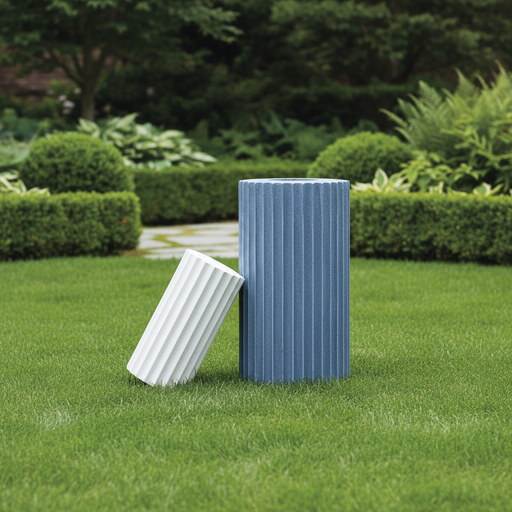 Fluted cylindrical containers with vertical grooves, inspired by classical Greek architectural columns, minimalist and sculptural design. Side Angle
