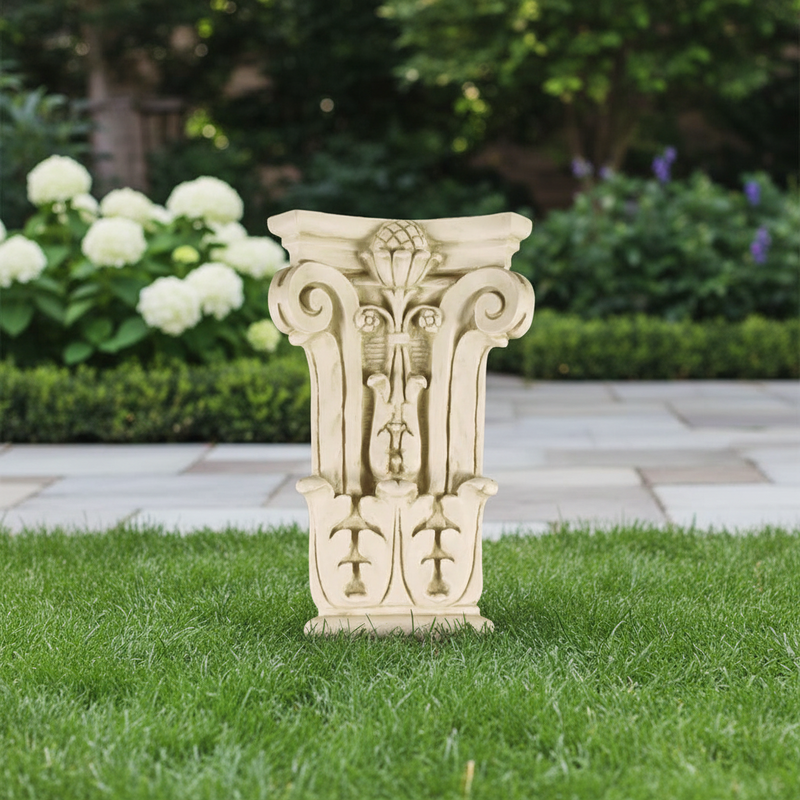 Corinthian capital with ornate acanthus leaves, scrollwork, and classical old world European detailing in a symmetrical design. Side Angle