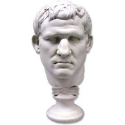 Classical Greco-Roman style male bust with strong features and short wavy hair on an ornate pedestal base.