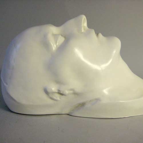 Classical European sculpted head with closed eyes, smooth features, and serene expression, evoking Renaissance and old world style. Different Angle