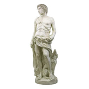 Classical Renaissance-style male statue with draped cloth, standing beside a dog, featuring detailed, lifelike sculptural elements.