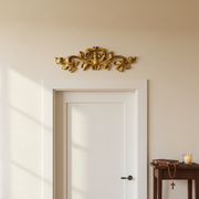 Ornate Baroque-style decorative applique with symmetrical scrollwork and classical old world European leaf motifs. Side Angle