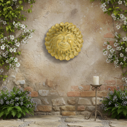 Sun face wall plaque with ornate, swirling rays and a whimsical, winking expression in an old world European classical style. Side Angle