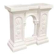 Classical console table with ornate floral reliefs, arched center opening, and column details in old world European style