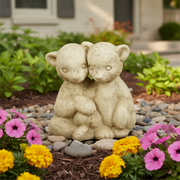 Two intricately detailed cubs sitting close together in an old world European, classical style with gentle, ornate features. Side Angle