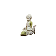 Cherub statue in classical Renaissance style seated atop an ornate fish, featuring detailed facial expression and curly hair.