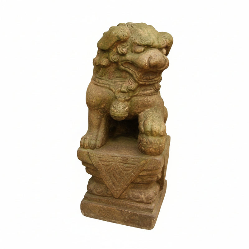 Stone guardian lion statue with ornate detailing, classical old world European style, seated on a decorative pedestal.