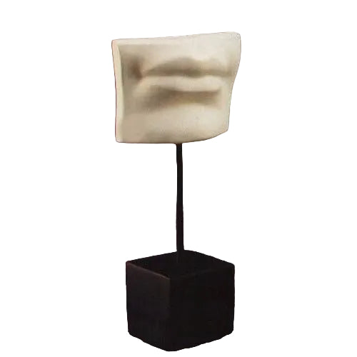 Classical Greek-inspired sculpted lips fragment on a pedestal stand, featuring minimalist and old world European design elements.
