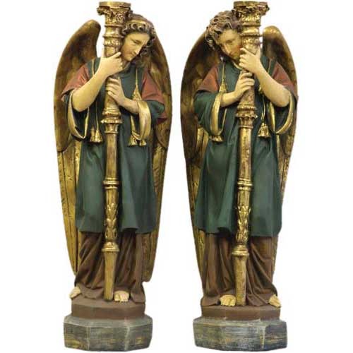 Pair of ornate Baroque-style angel statues with detailed wings, classical robes, and tall candlesticks in a reverent pose.