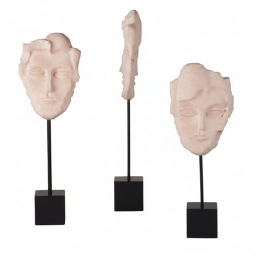 Fragmented classical face sculptures on black stands, featuring old world European and Renaissance-inspired ornate detailing.