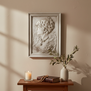Classical bas-relief portrait of a woman in ornate Victorian attire with elaborate jewelry, framed in an old world European style. Side Angle