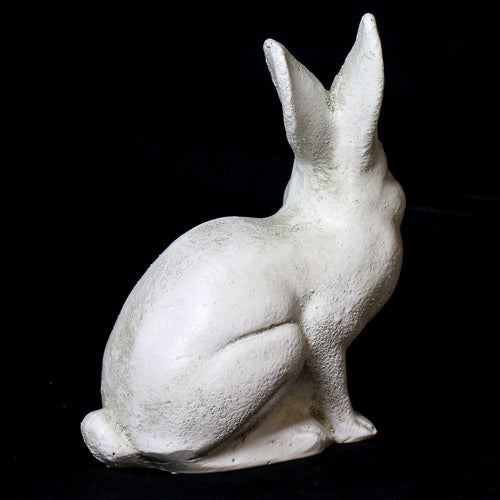 Sitting rabbit statue with elongated ears, featuring classical old world European sculptural details and subtle ornate accents. Side View