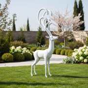 Stag sculpture with elongated, ornate antlers in a classical, old world European style, featuring elegant, flowing lines. Side Angle