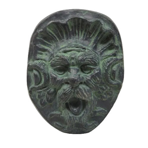 Grotesque face fountain mask with ornate Baroque detailing and classical old world European features, open mouth and stylized hair.