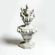Baroque-style ornate bust with stylized flames rising from the top, featuring classical sculptural detailing and intricate design. Side View