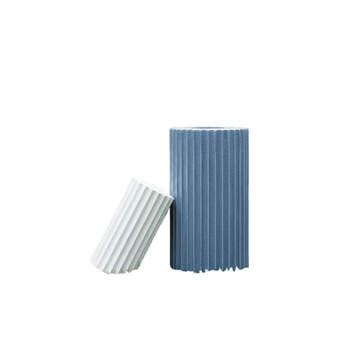 Fluted cylindrical containers with vertical grooves, inspired by classical Greek architectural columns, minimalist and sculptural design.