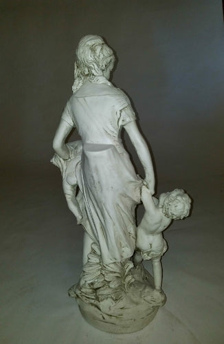 Classical European statue of a woman with two children, featuring ornate, old world detailing and Renaissance-inspired drapery. Different Angle