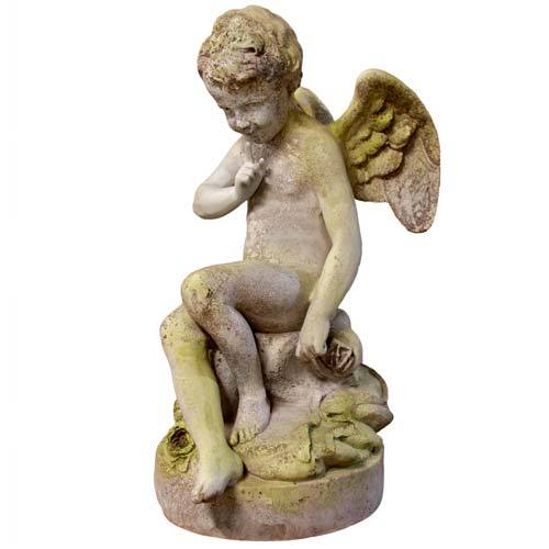 Sitting winged cherub with a finger to its lips in a "shushing" pose on a cloud-like base.