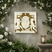 Cherubs in ornate Baroque relief frame an oval medallion with a classical figure, surrounded by intricate gilded detailing. Side Angle
