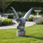 Gothic gargoyle statue with outstretched wings, fierce expression, and ornate medieval detailing on a pedestal. Side Angle