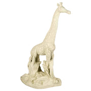 Giraffe statue with ornate detailing and classical old world European style, standing on a textured base with sculpted foliage.