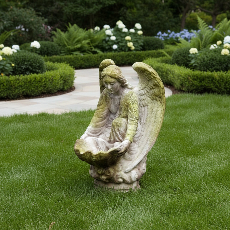 Innocent Kneeling angel holding a large scalloped shell bowl. Outdoor Statue (18-Inch)