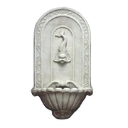Wall fountain with ornate old world European design, arched backplate, and classical dolphin spout in relief above scalloped basin.