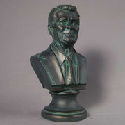 Classical-style bust of a distinguished man in a suit and tie with detailed facial features and an ornate pedestal base. Side Angle