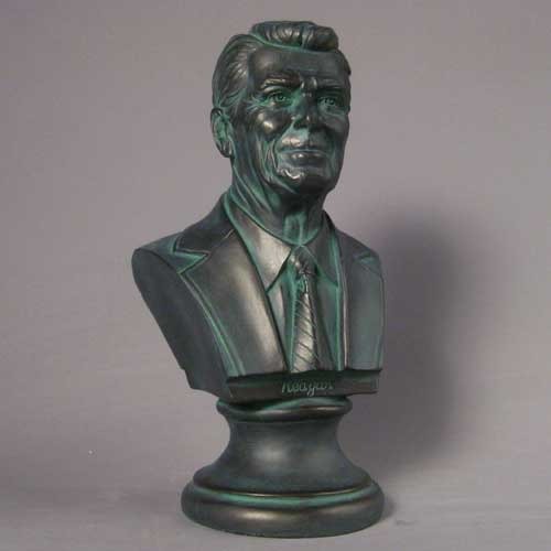 Classical-style bust of a distinguished man in a suit and tie with detailed facial features and an ornate pedestal base. Side Angle