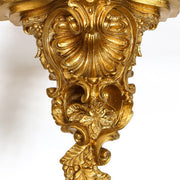 Baroque wall bracket with ornate scrollwork, acanthus leaves, and shell motif in old world European classical style. Side View