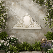 Ornate Baroque-style mirror frame with cherubs, floral detailing, and classical old world European decorative motifs. Side Angle