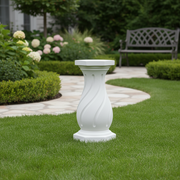 Ornate classical pedestal with a fluted, swirling design and octagonal base, inspired by old world European architectural style. Side Angle