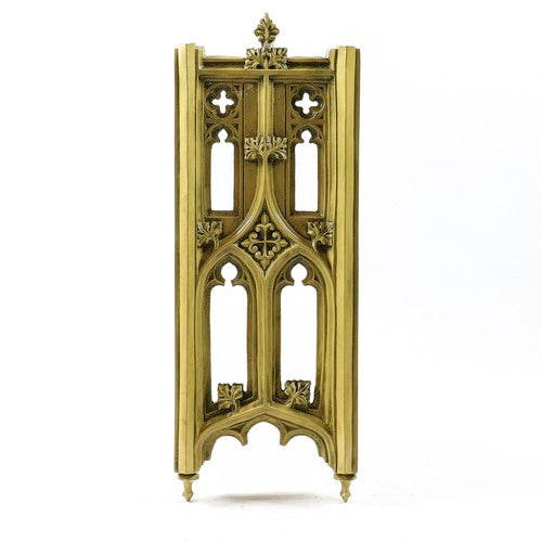 Gothic-style ornate panel with pointed arches, quatrefoil cutouts, and intricate classical detailing reminiscent of medieval architecture.