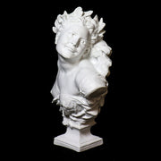 Bust of a smiling woman with laurel wreath, draped garment, and ornate detailing in classical Baroque style. Side View