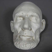 Classical old world European sculpted head with closed eyes, detailed facial features, and a prominent beard in Renaissance style. Other Angle
