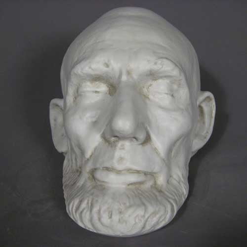 Classical old world European sculpted head with closed eyes, detailed facial features, and a prominent beard in Renaissance style. Other Angle
