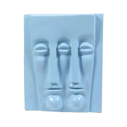 Abstract sculptural wall art featuring two elongated, stylized faces in a minimalist, classical European-inspired design.