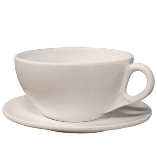 Teacup with matching saucer featuring a simple, classical silhouette and subtle old world European design influences.