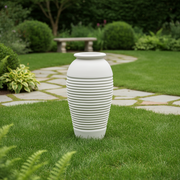 Classical urn with ribbed detailing and a rounded lip, inspired by old world European and Greek architectural styles. Side Angle