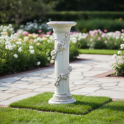 Classical fluted pedestal with ornate floral garlands and intricate old world European detailing in a Renaissance style. Side Angle