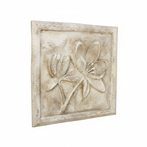 Floral relief wall plaque with ornate old world European style, featuring classical botanical motifs in a square frame.