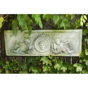 Rectangular old world European relief panel with ornate cherubs and classical face medallion in Baroque architectural style. Side View