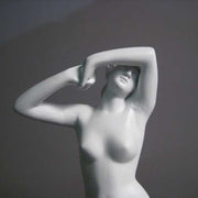 Classical female torso sculpture with raised arms, inspired by Renaissance and Greek art, featuring smooth, elegant contours.